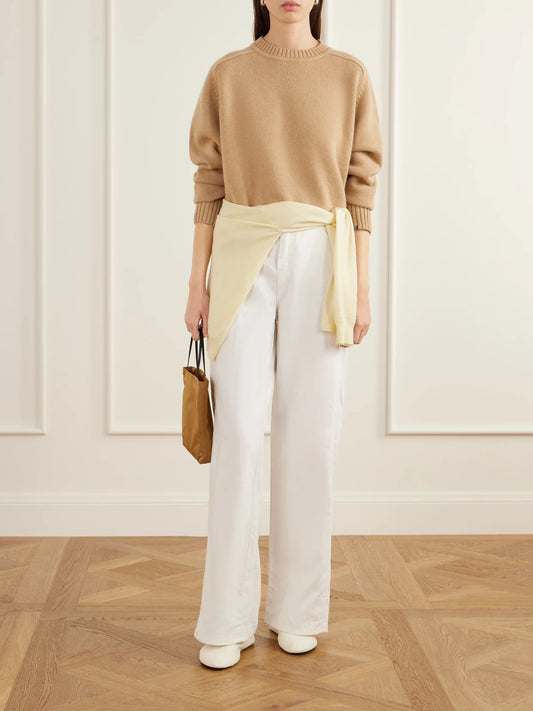 Image of a model wearing Outerwear. Product name - Please Cashmere Turtleneck Sweater in Camel, Black colour by brand - Extreme Cashmere