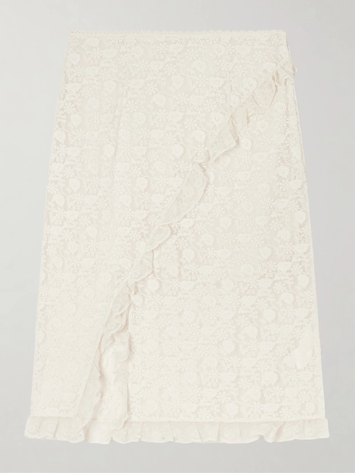Image of a model wearing Skirts. Product name - Aurella Ruffled Embroidered Mesh Midi Skirt in Ecru colour by brand - DÔEN