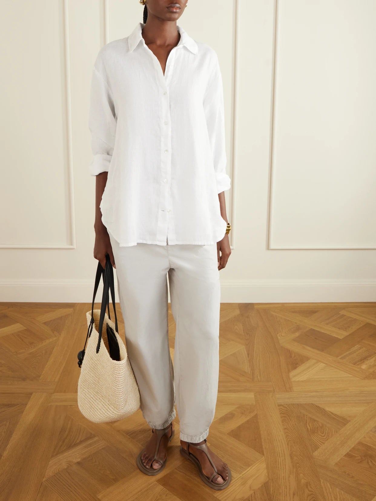 Image of a model wearing Pants. Product name - Cotton-blend Poplin Balloon Pants in Off-white colour by brand - James Perse