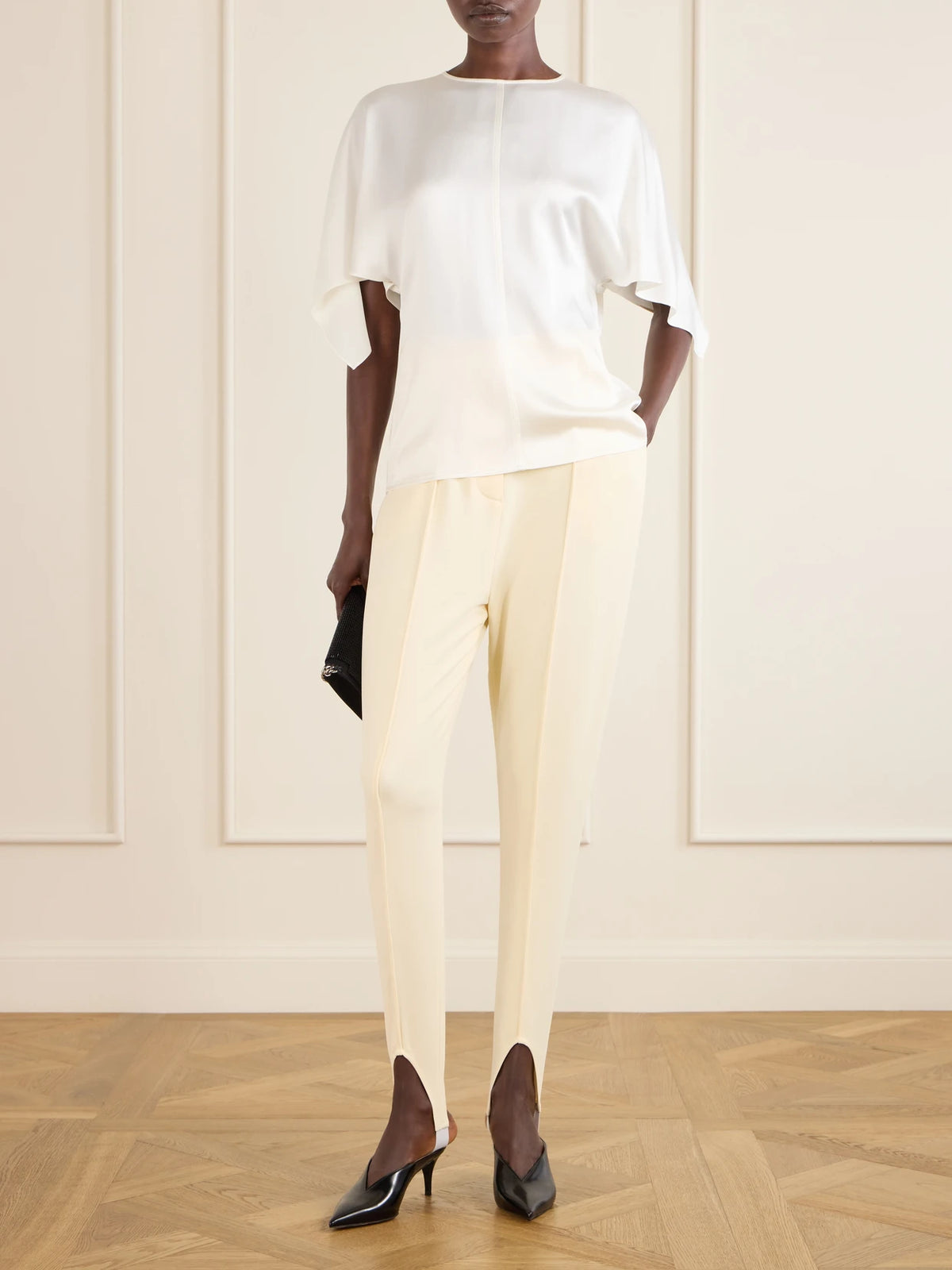 Image of a model wearing Tops. Product name - Open-back Satin Blouse in White colour by brand - Stella McCartney