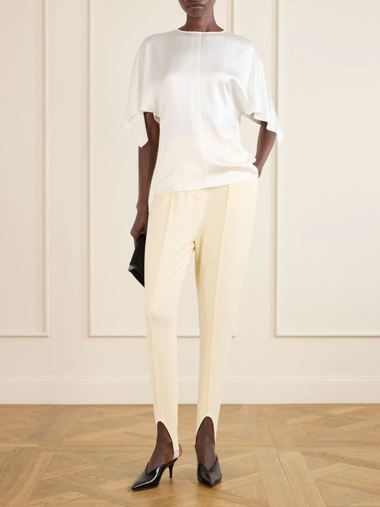 Image of a model wearing Tops. Product name - Open-back Satin Blouse in White colour by brand - Stella McCartney