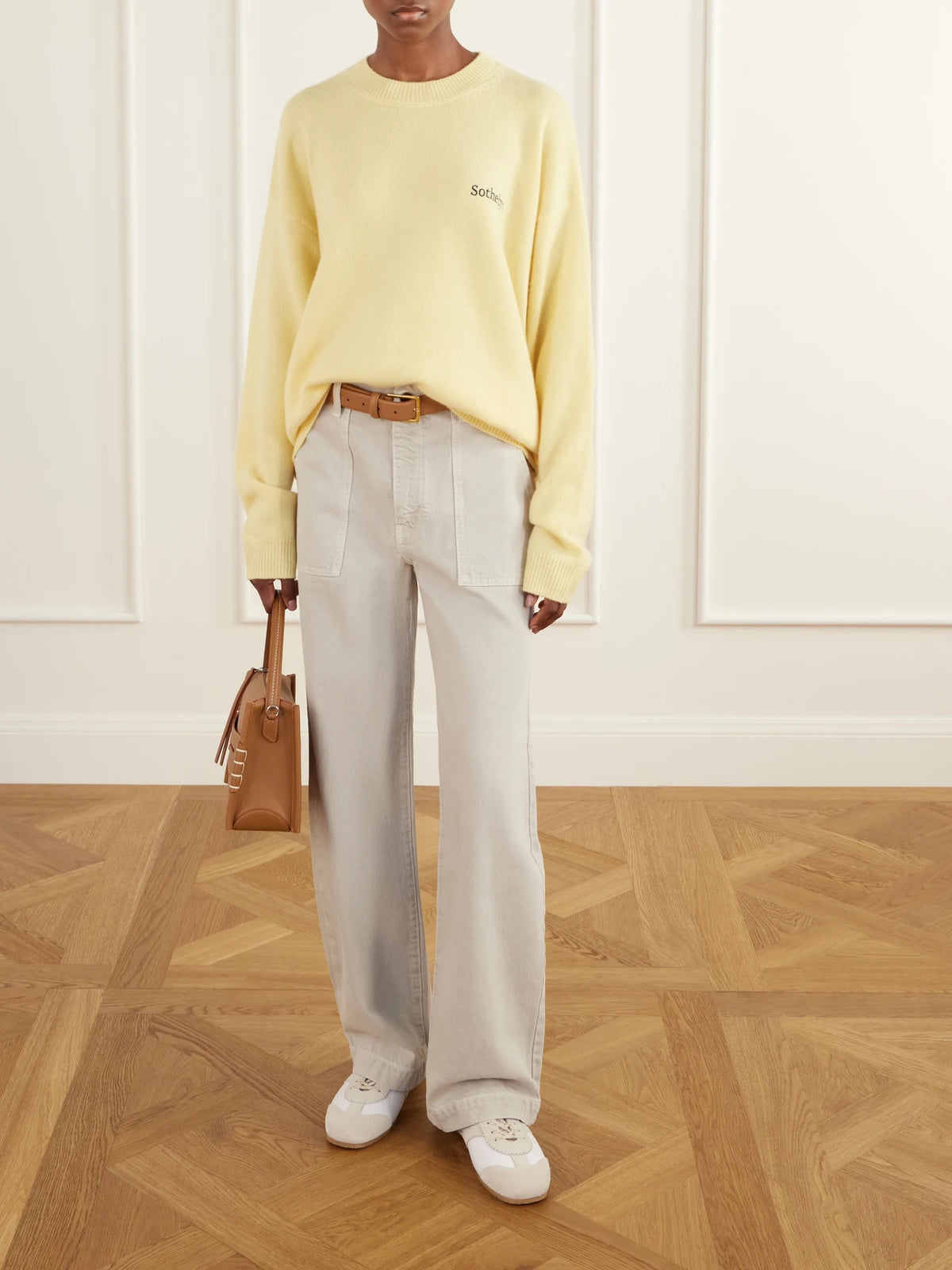 Image of a model wearing Tops. Product name - + Sotheby's Logo-embroidered Cashmere Sweater in Yellow, Cream colour by brand - FRAME