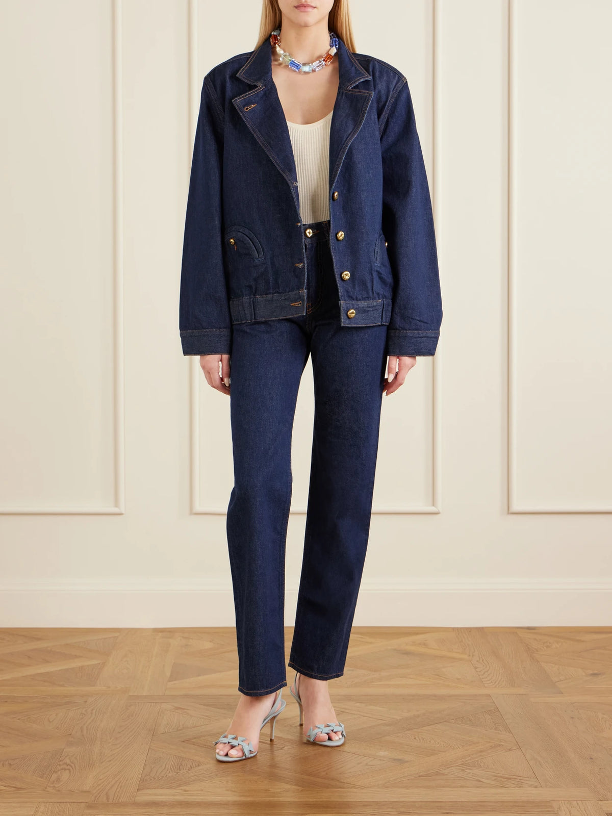 Image of a model wearing Pants. Product name - Mid-rise Straight-leg Jeans in Dark denim colour by brand - BLAZÉ Milano