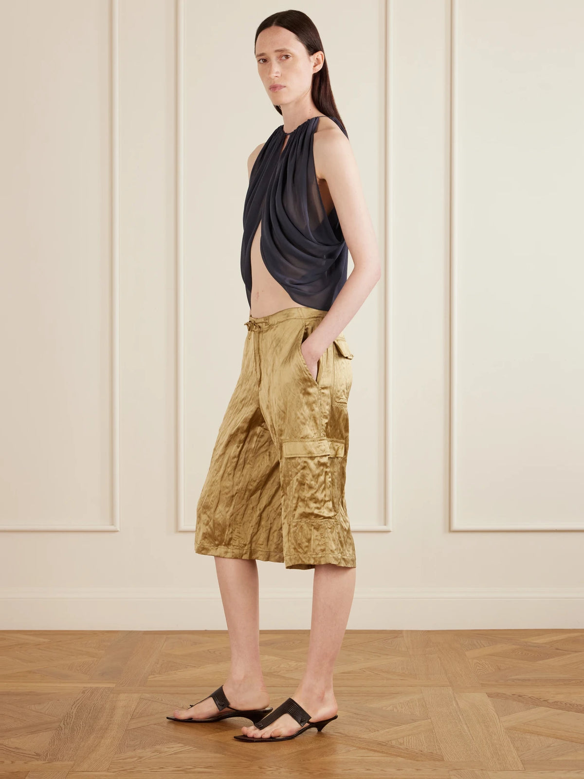 Image of a model wearing Tops. Product name - Reysa Gathered Silk-crepe Top in Storm blue colour by brand - AFLALO