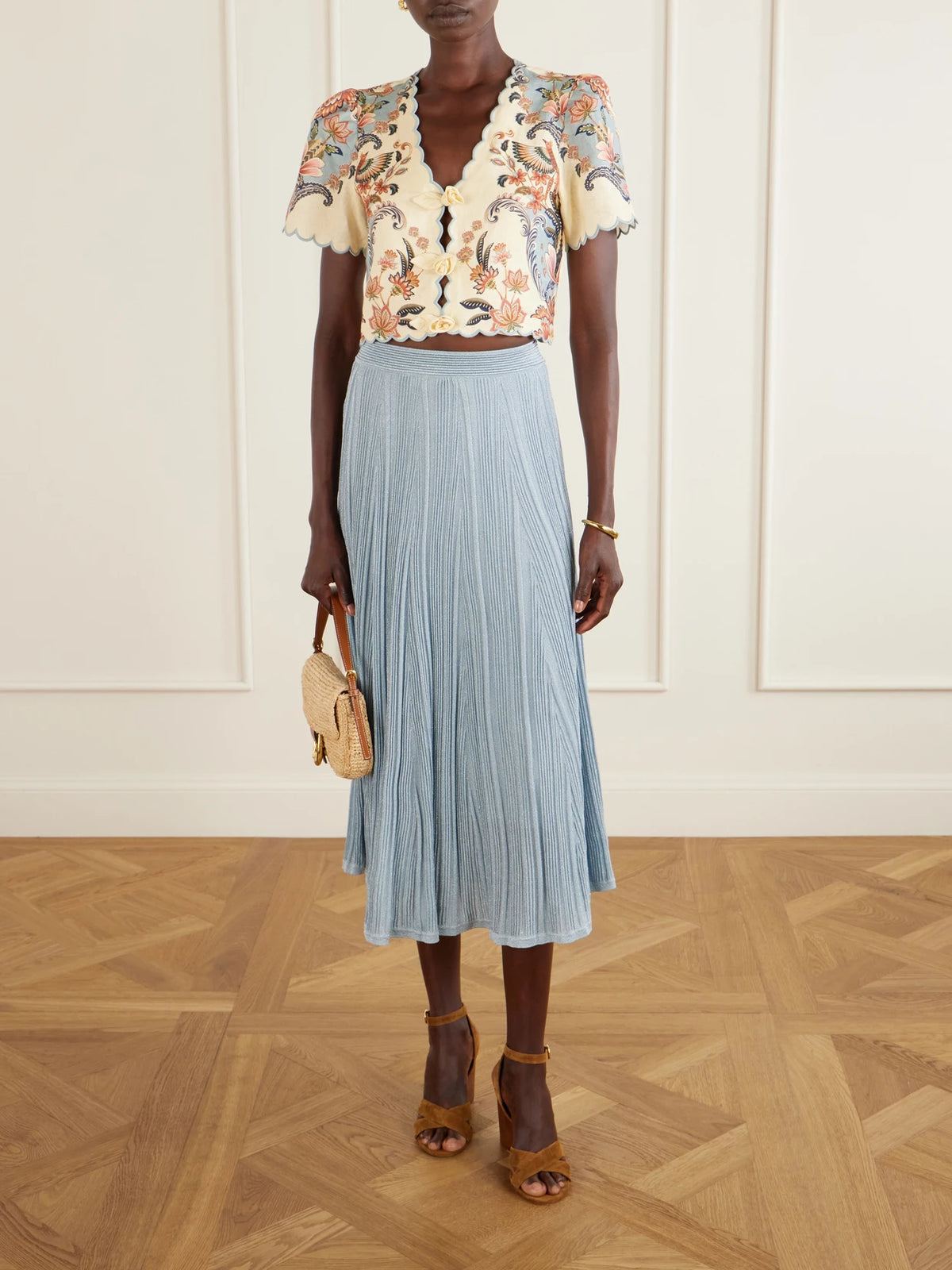 Image of a model wearing Skirts. Product name - Aster Metallic Ribbed-knit Midi Skirt in Blue colour by brand - Zimmermann