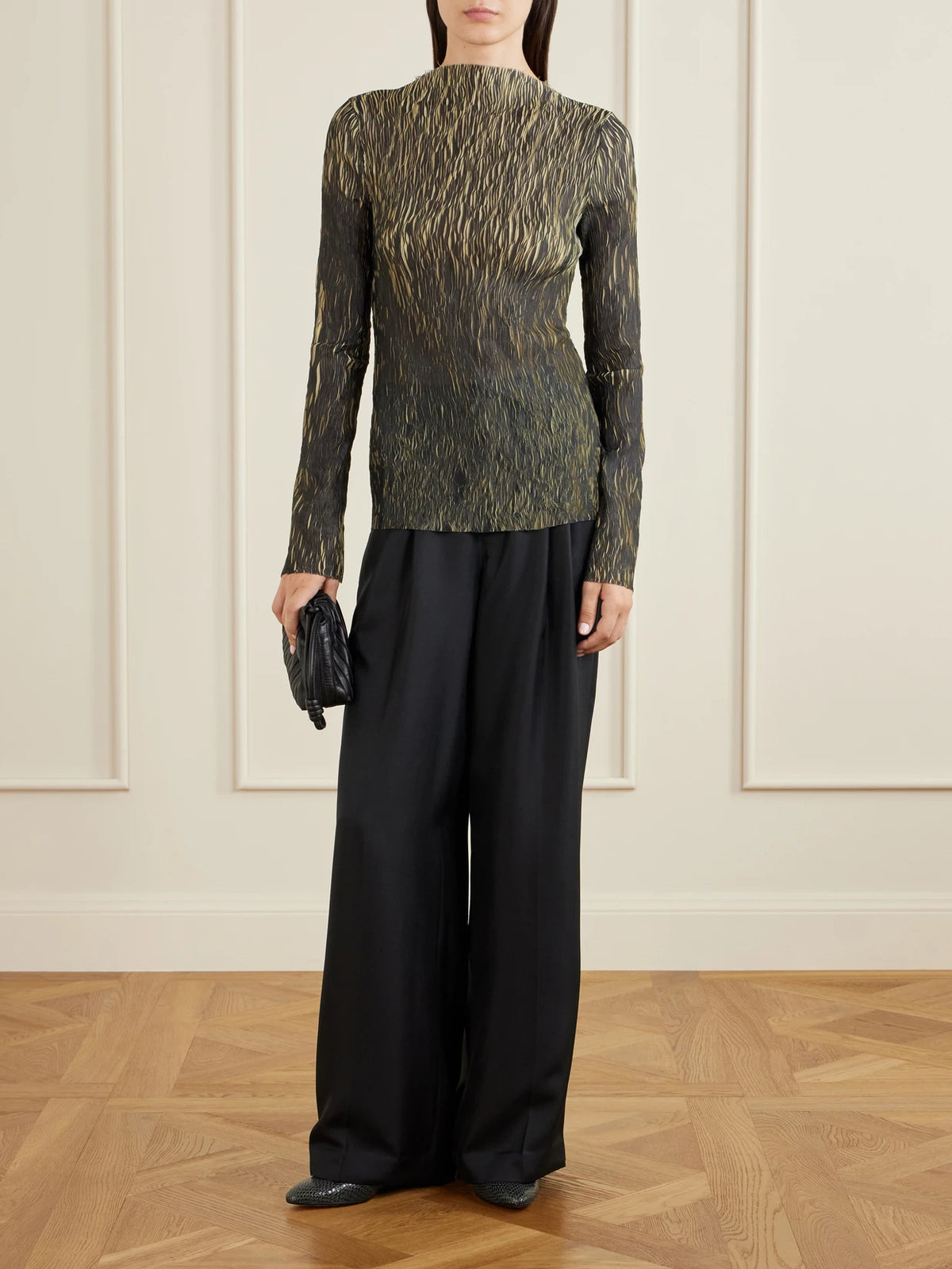 Image of a model wearing Tops. Product name - Plissé Blouse in Green colour by brand - LIBEROWE