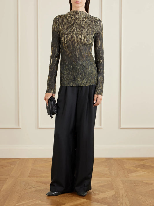 Image of a model wearing Tops. Product name - Plissé Blouse in Green colour by brand - LIBEROWE