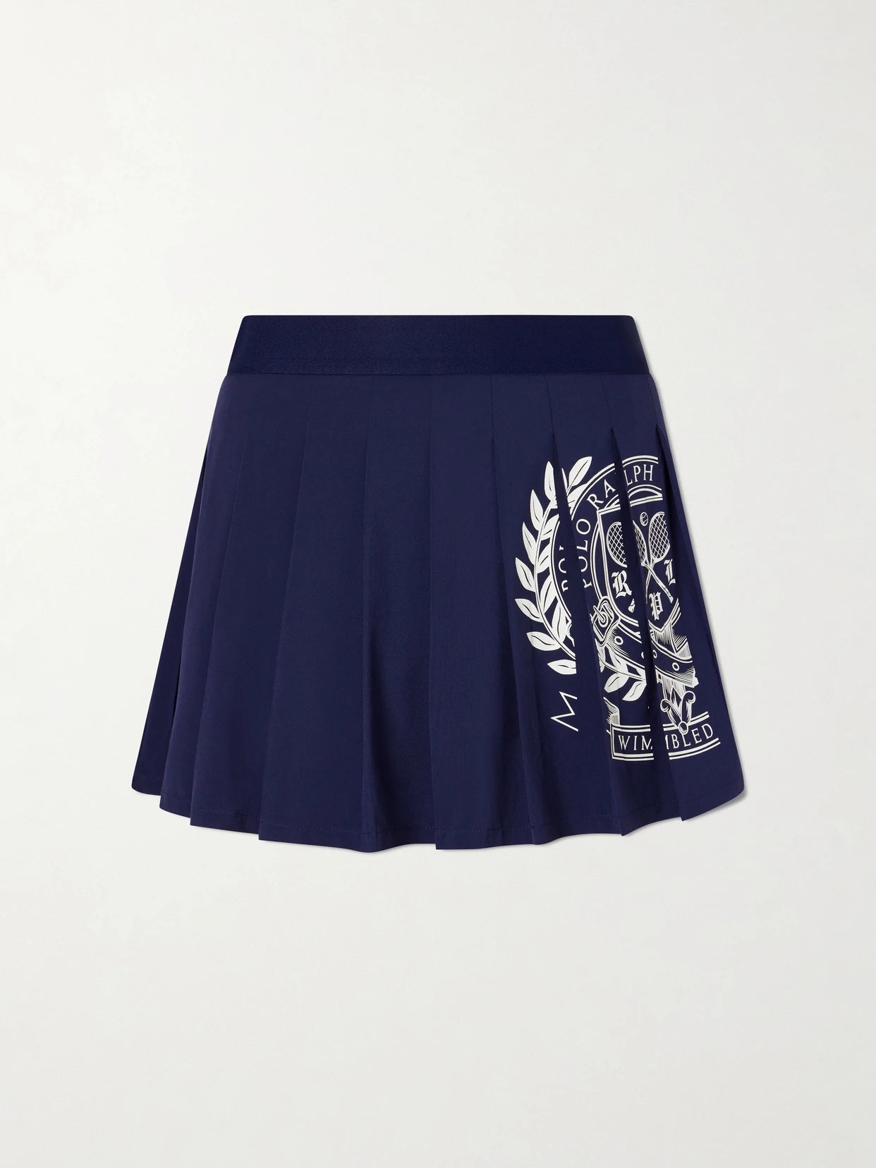 Image of a model wearing Skirts. Product name - + Wimbledon Pleated Logo-printed Crepe Mini Skirt in Navy colour by brand - Polo Ralph Lauren