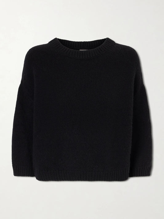 Image of a model wearing Outerwear. Product name - Sabina Cashmere Sweater in Black colour by brand - KHAITE