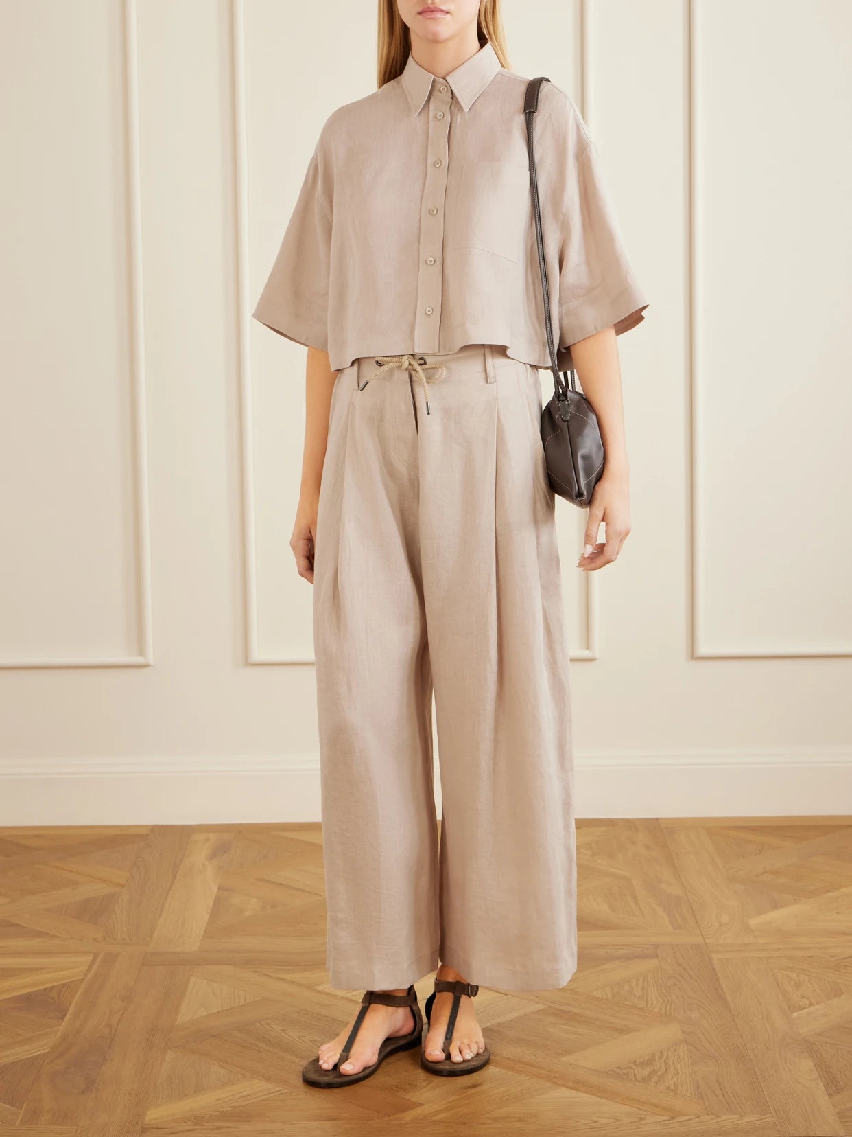 Image of a model wearing Tops. Product name - Cropped Cotton Shirt in Sand colour by brand - Brunello Cucinelli