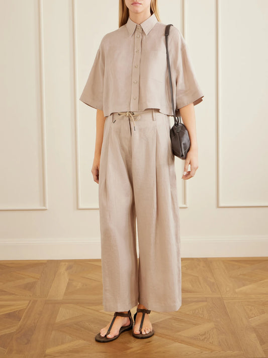 Image of a model wearing Tops. Product name - Cropped Cotton Shirt in Sand colour by brand - Brunello Cucinelli
