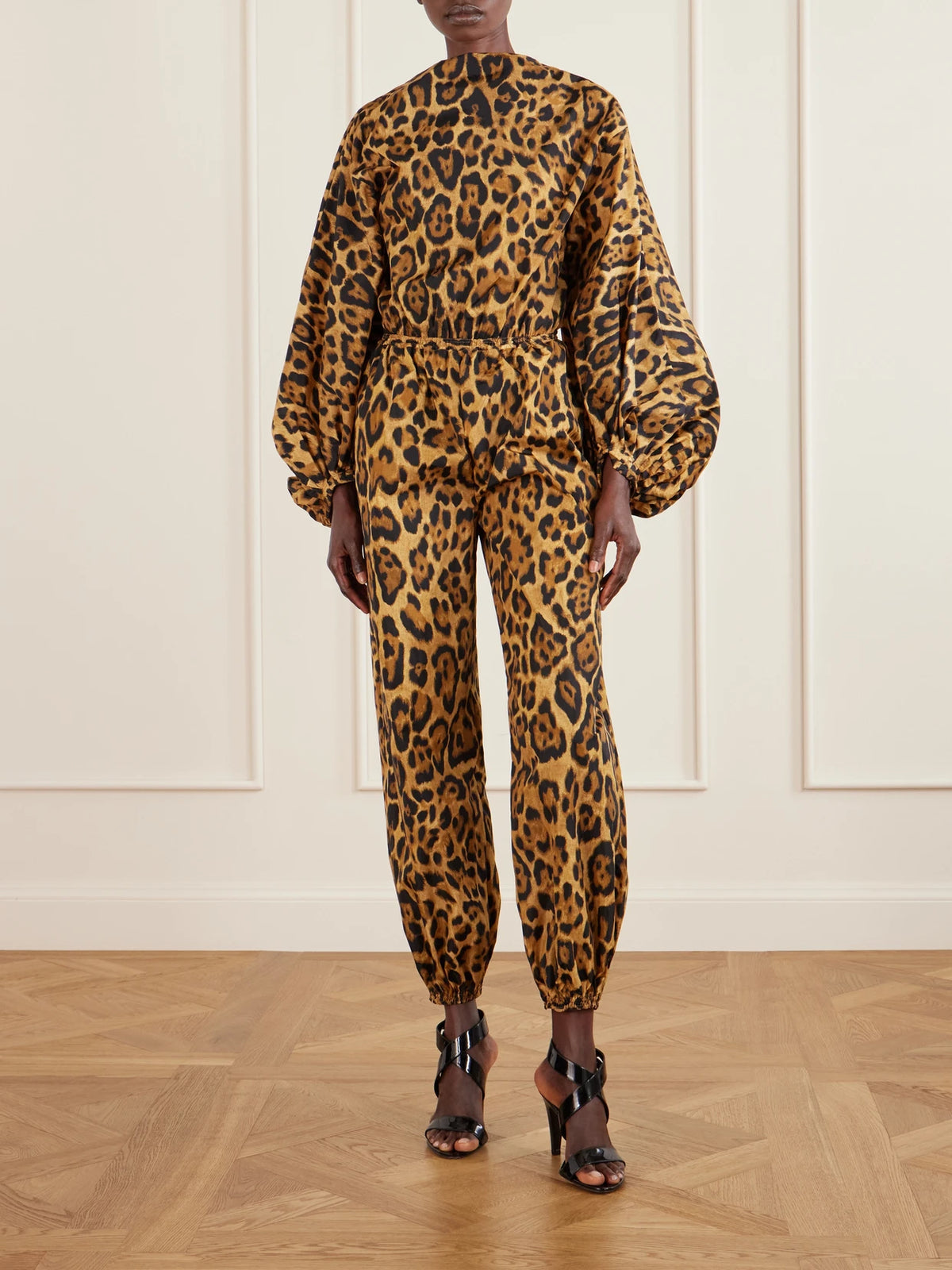 Image of a model wearing Pants. Product name - Leopard-print Shell Balloon Pants in Leopard print colour by brand - Alaïa
