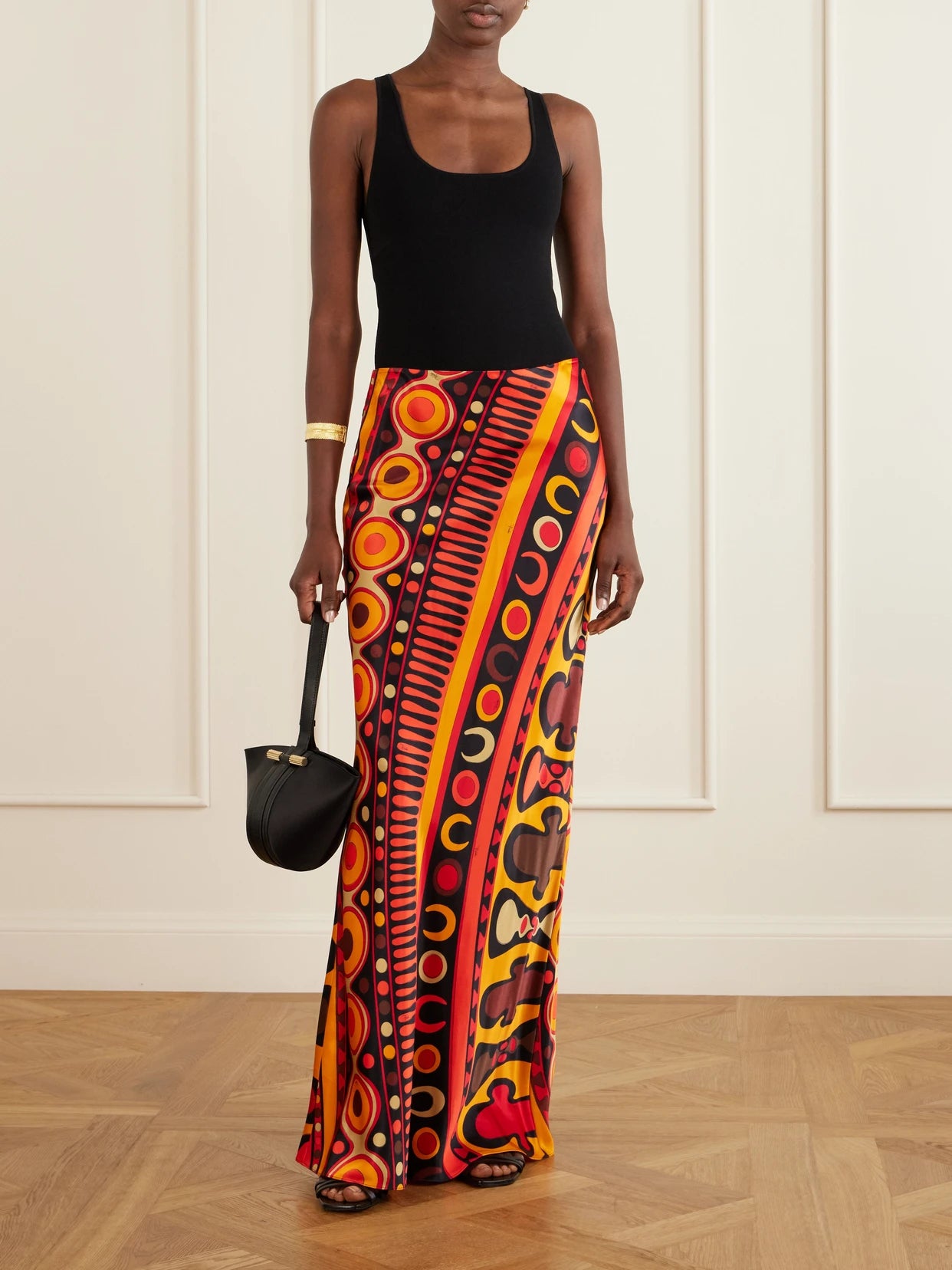 Image of a model wearing Skirts. Product name - Printed Tulle Maxi Skirt in Orange colour by brand - PUCCI