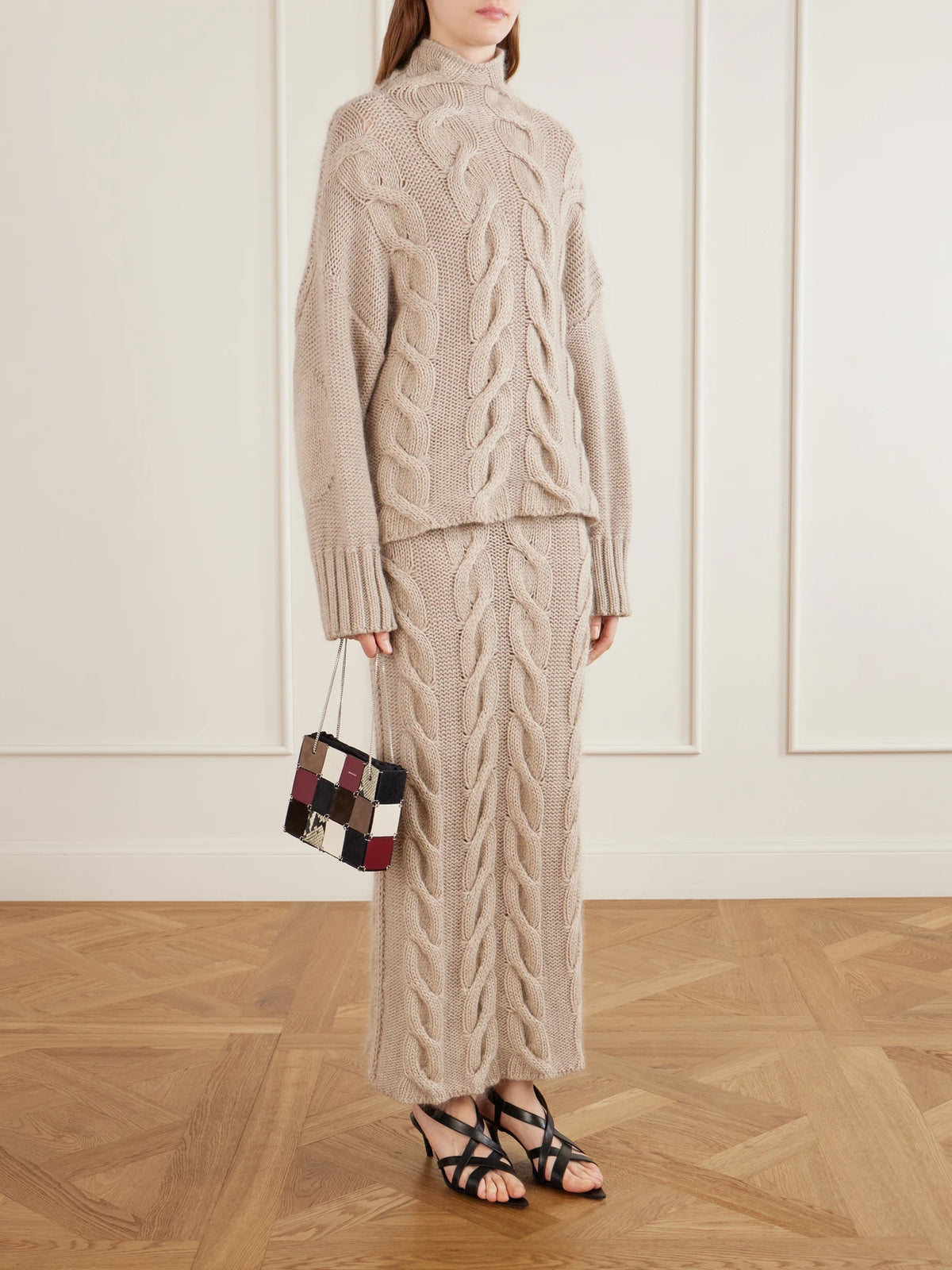 Image of a model wearing Skirts. Product name - Ziva Cable-knit Cashmere, Mohair And Silk-blend Midi Skirt in Beige colour by brand - KHAITE