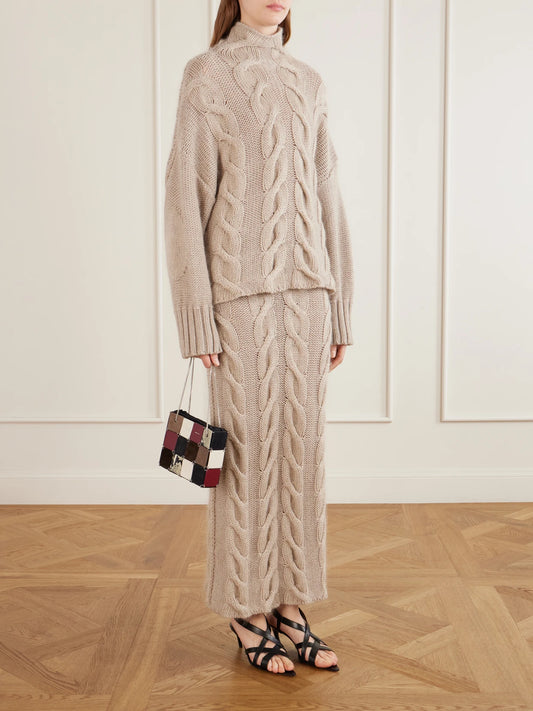 Image of a model wearing Skirts. Product name - Ziva Cable-knit Cashmere, Mohair And Silk-blend Midi Skirt in Beige colour by brand - KHAITE