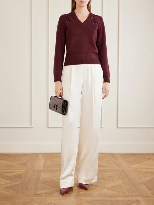 Image of a model wearing Pants. Product name - Pleated Satin Straight-leg Pants in Cream colour by brand - Self-Portrait