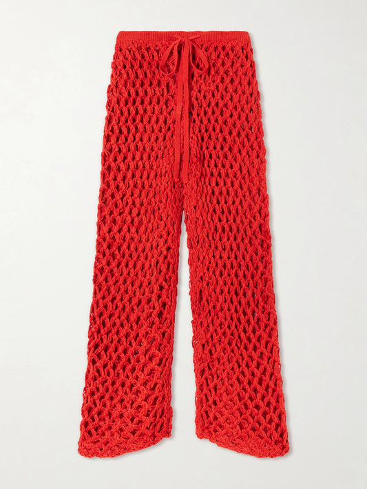 Image of a model wearing Pants. Product name - Clara Crocheted Straight-leg Pants in Red colour by brand - Haight