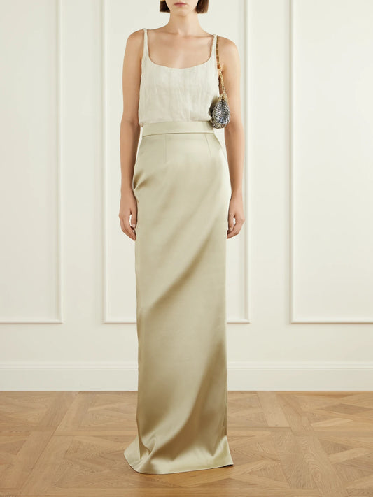Image of a model wearing Skirts. Product name - Sirena Satin Maxi Skirt in Sand colour by brand - Ilkyaz Ozel