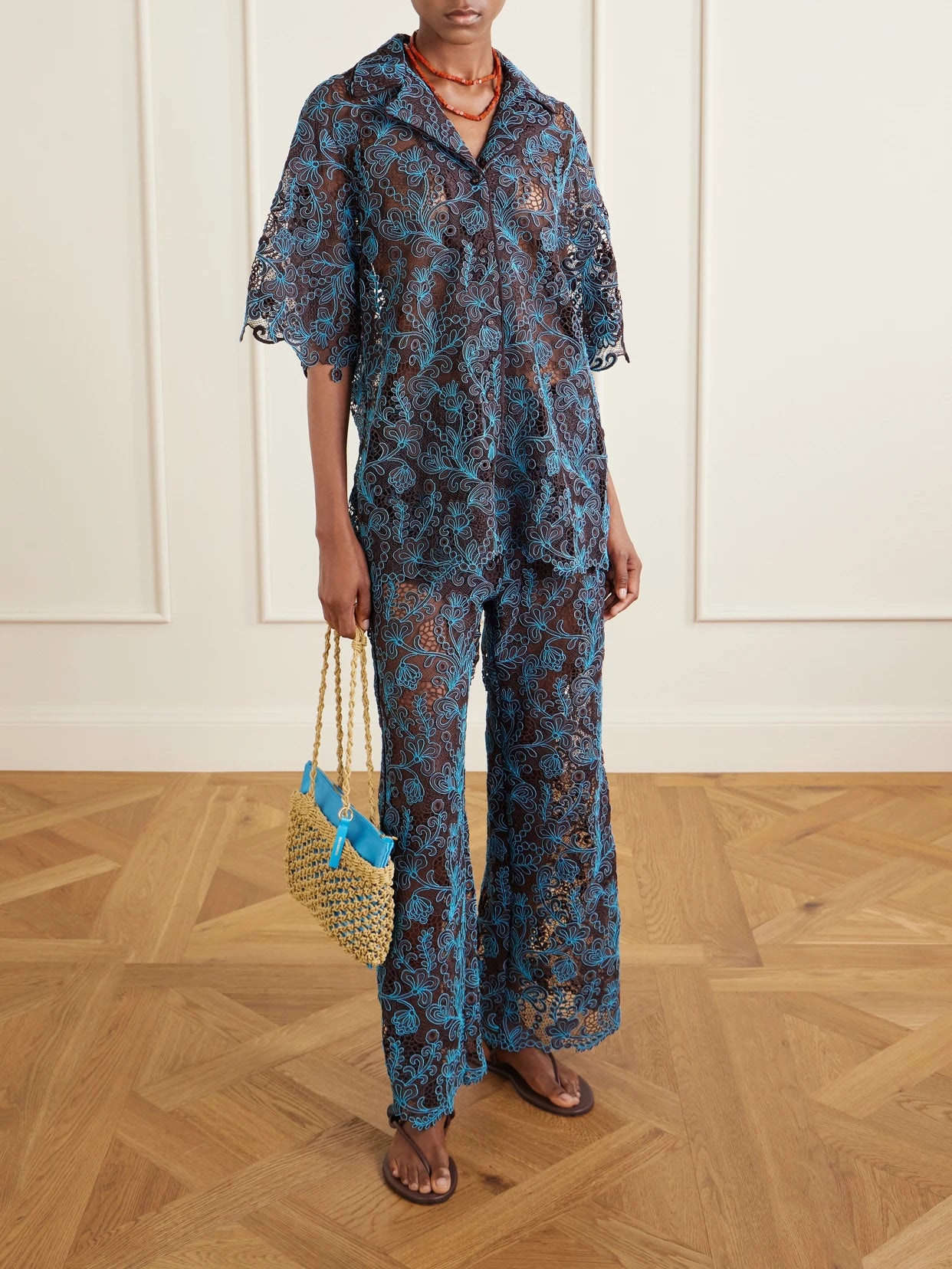 Image of a model wearing Pants. Product name - Francine Lace Wide-leg Pants in Chocolate colour by brand - ALÉMAIS