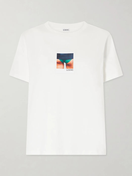 Image of a model wearing Tops. Product name - Appliquéd Cotton-jersey T-shirt in White colour by brand - LOEWE