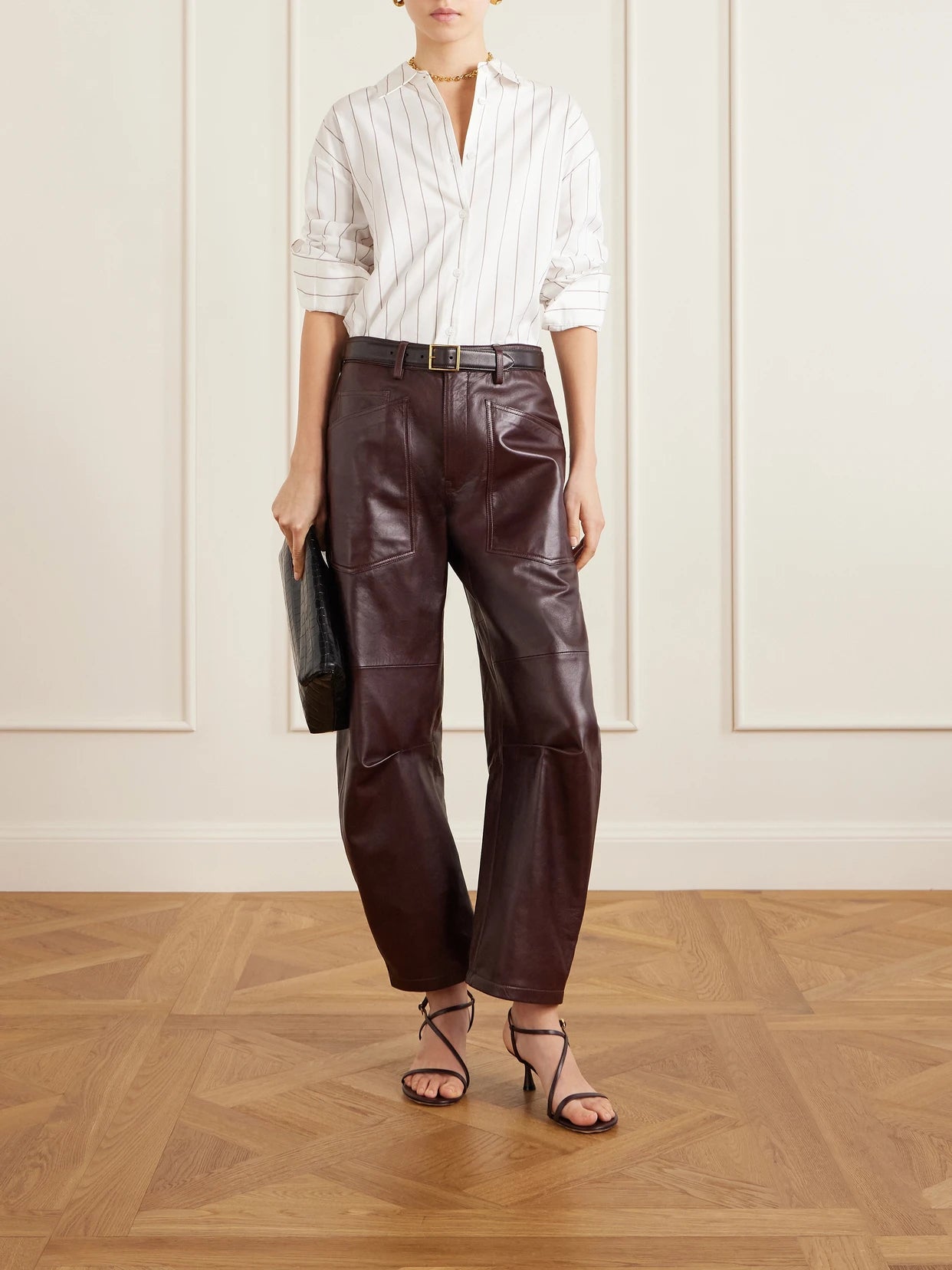 Image of a model wearing Pants. Product name - Shon Leather Barrel-leg Pants in Burgundy colour by brand - Nili Lotan