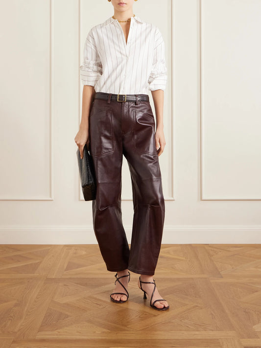 Image of a model wearing Pants. Product name - Shon Leather Barrel-leg Pants in Burgundy colour by brand - Nili Lotan