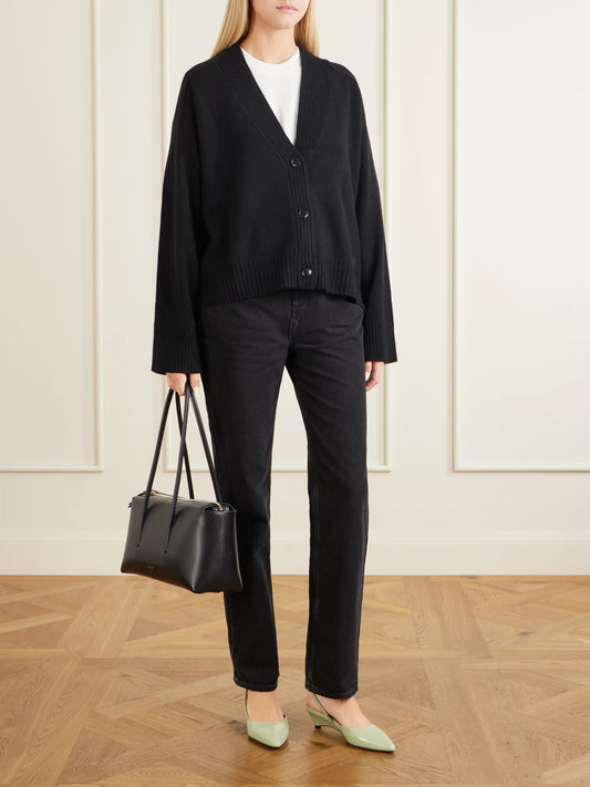 Image of a model wearing Outerwear. Product name - Kaia Lds Cashmere Cardigan in Black colour by brand - Loulou de Saison