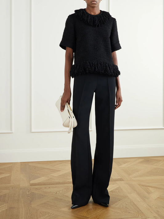 Image of a model wearing Tops. Product name - Fringed Wool-blend Tweed Top in Black, Cream colour by brand - LIBEROWE