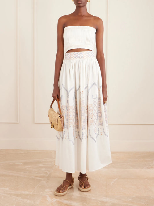 Image of a model wearing Skirts. Product name - Ombretta Embroidered Cotton-blend Poplin Midi Skirt in White colour by brand - Emporio Sirenuse