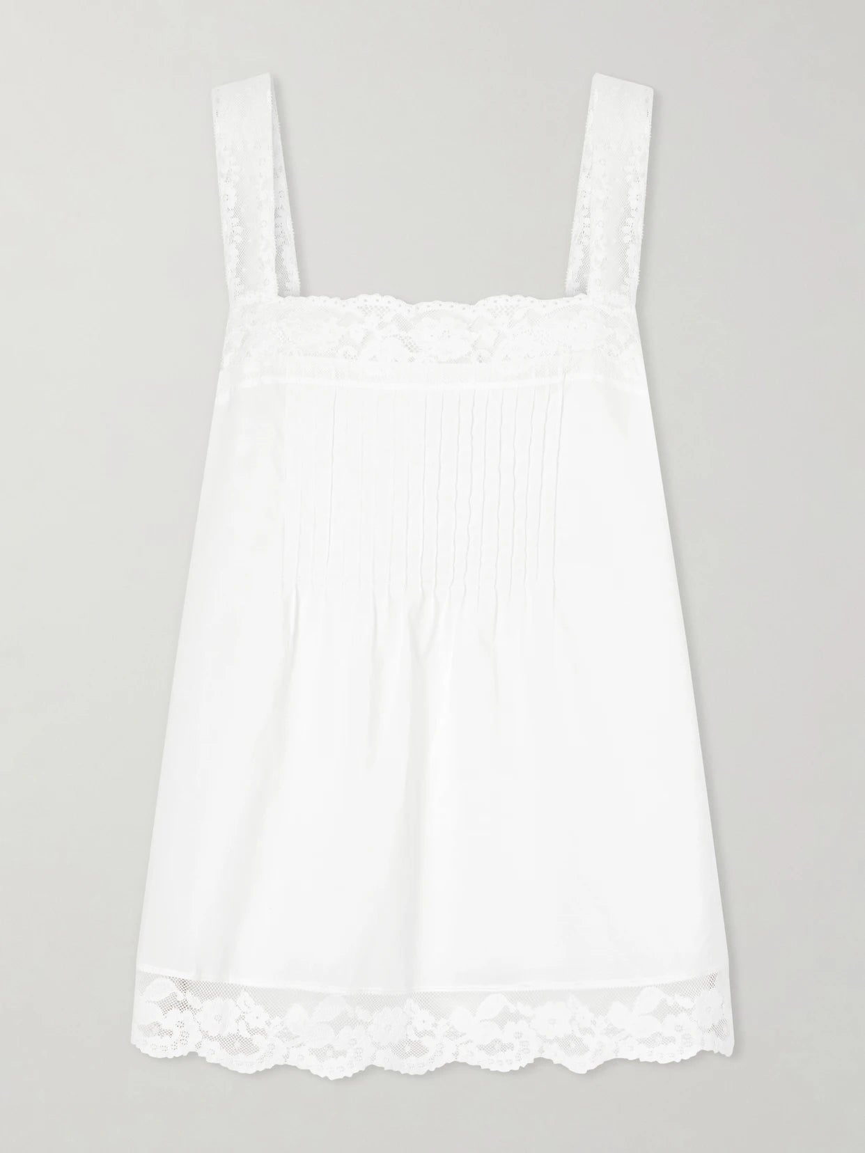 Image of a model wearing Tops. Product name - Cristina Lace-trimmed Cotton Top in White colour by brand - Faithfull