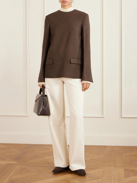 Image of a model wearing Tops. Product name - Twill Blouse in Brown colour by brand - TOTEME