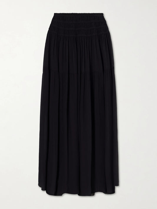 Image of a model wearing Skirts. Product name - Midnight Shirred Muslin Maxi Skirt in Black colour by brand - Eres