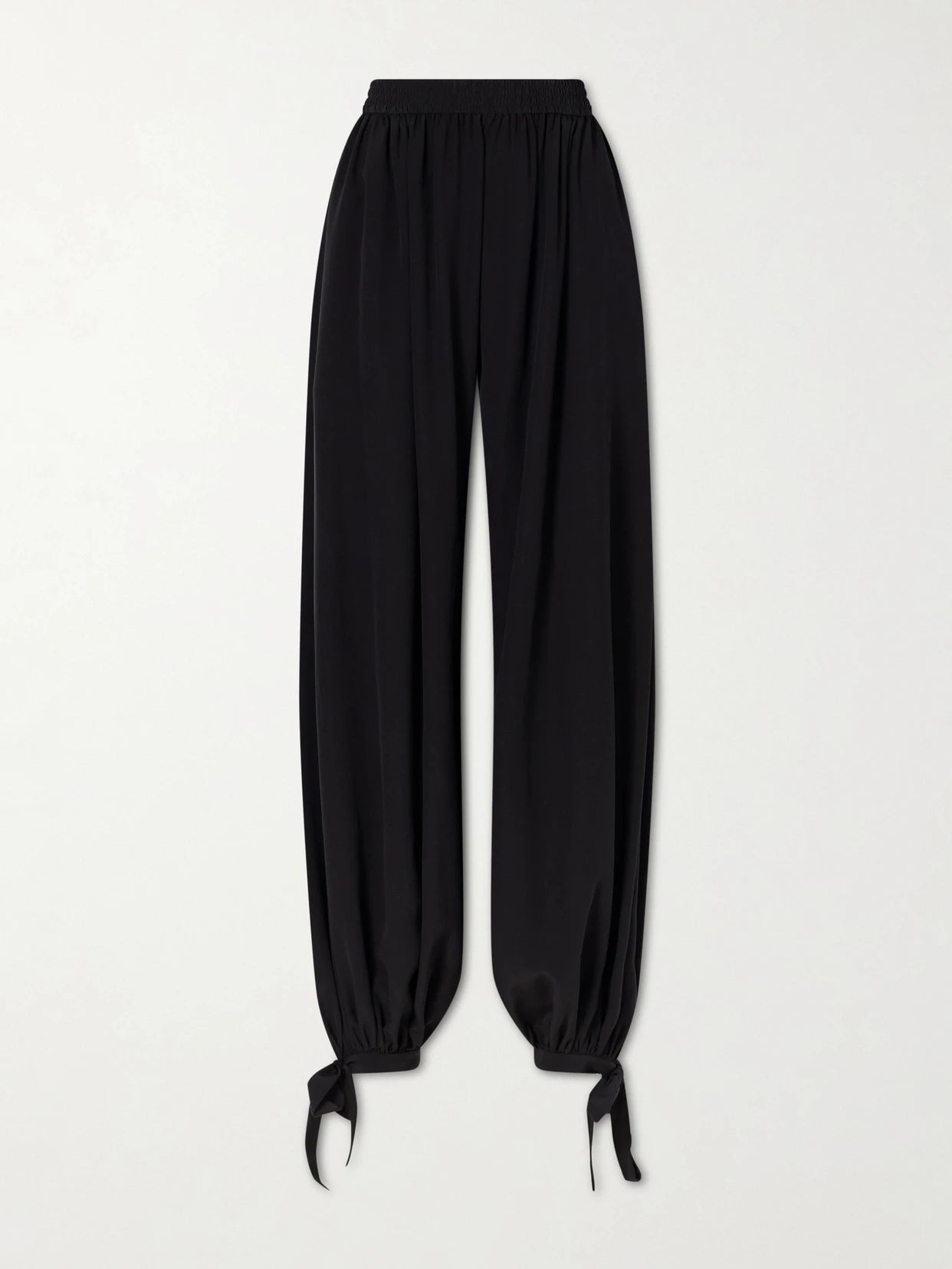 Image of a model wearing Pants. Product name - Silk Crepe De Chine Balloon Pants in Black colour by brand - Chloé