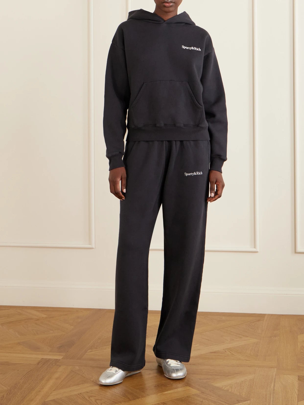 Image of Sleepwear & Loungewear. Product name - Logo Embroidered Cotton Sweatshirt in Black colour by brand - Sporty & Rich