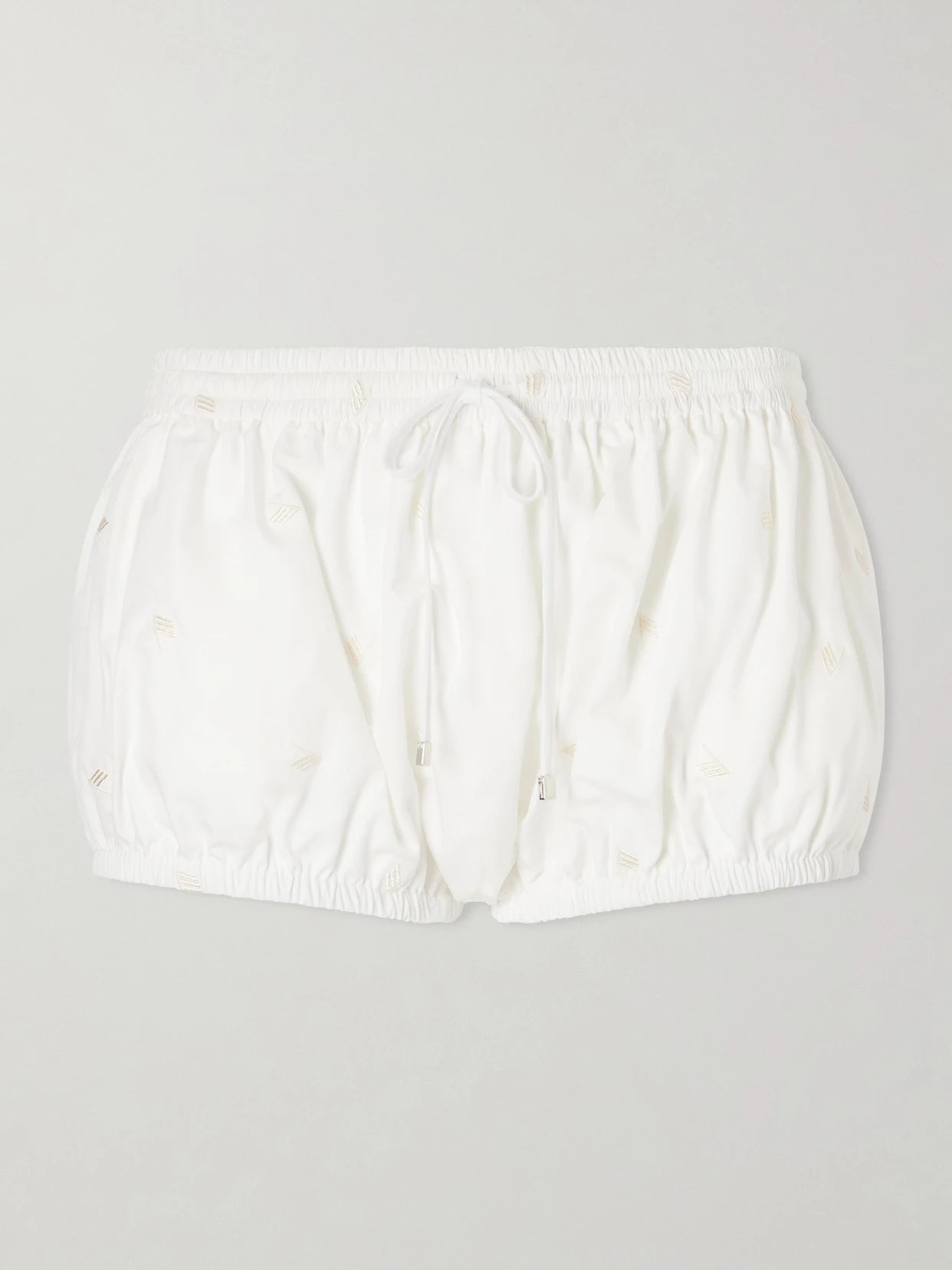 Image of a model wearing Shorts. Product name - Embroidered Cotton-blend Shorts in White colour by brand - The Attico
