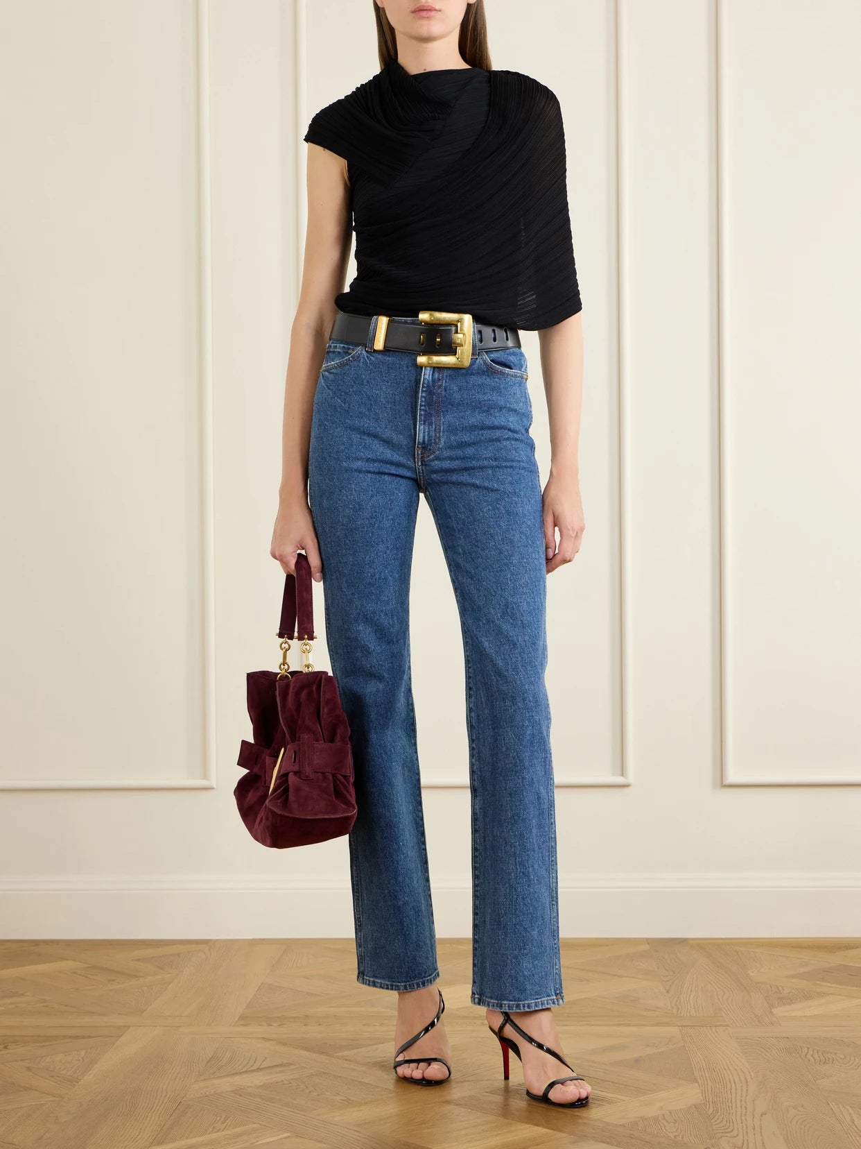 Image of a model wearing Tops. Product name - Draped Ribbed Jersey Blouse in Black colour by brand - Balmain