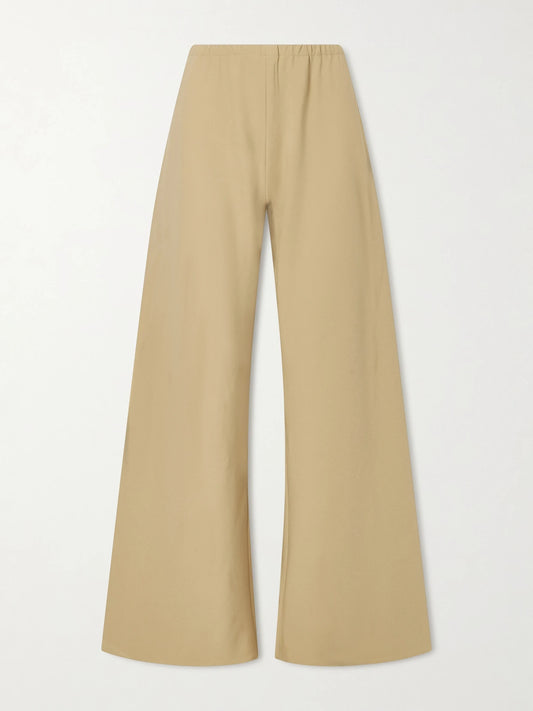 Image of a model wearing Pants. Product name - Colby Recycled Stretch-crepe Wide-leg Pants in Beige colour by brand - La Ligne