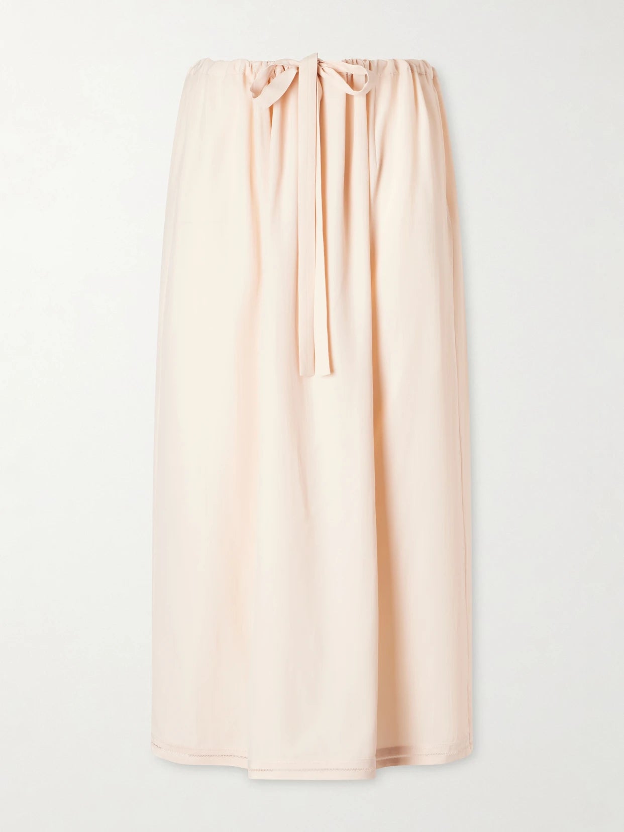Image of a model wearing Skirts. Product name - Silk Midi Skirt in Baby pink colour by brand - TOTEME