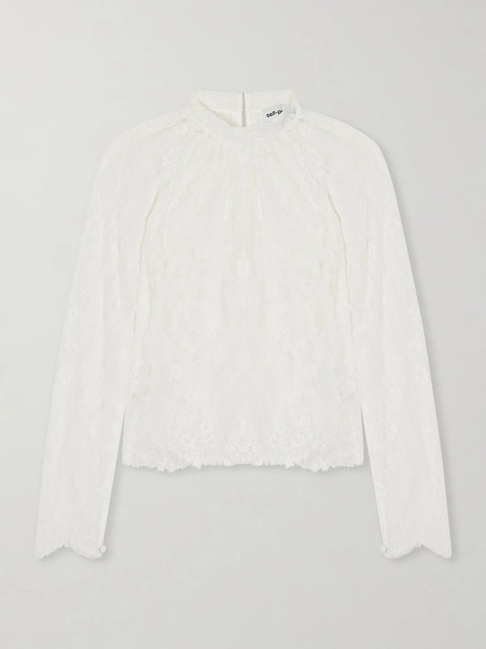 Image of a model wearing Tops. Product name - Scalloped Lace Blouse in White colour by brand - Self-Portrait