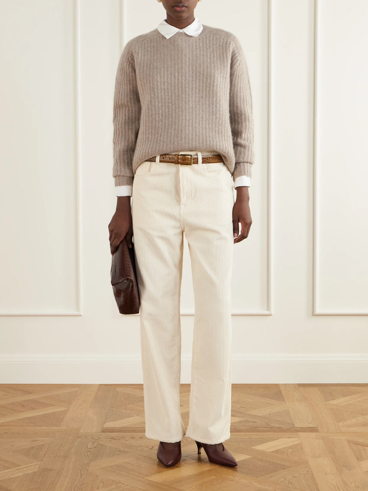 Image of a model wearing Outerwear. Product name - Nisha Ribbed Cashmere Sweater in Beige colour by brand - Arch4