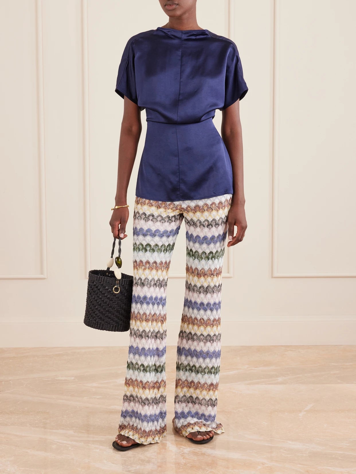 Image of a model wearing Pants. Product name - Embellished Crochet-knit Flared Pants in Multi colour by brand - Missoni