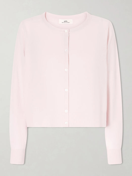 Image of a model wearing Outerwear. Product name - Bea Cashmere Cardigan in Pastel pink colour by brand - Arch4
