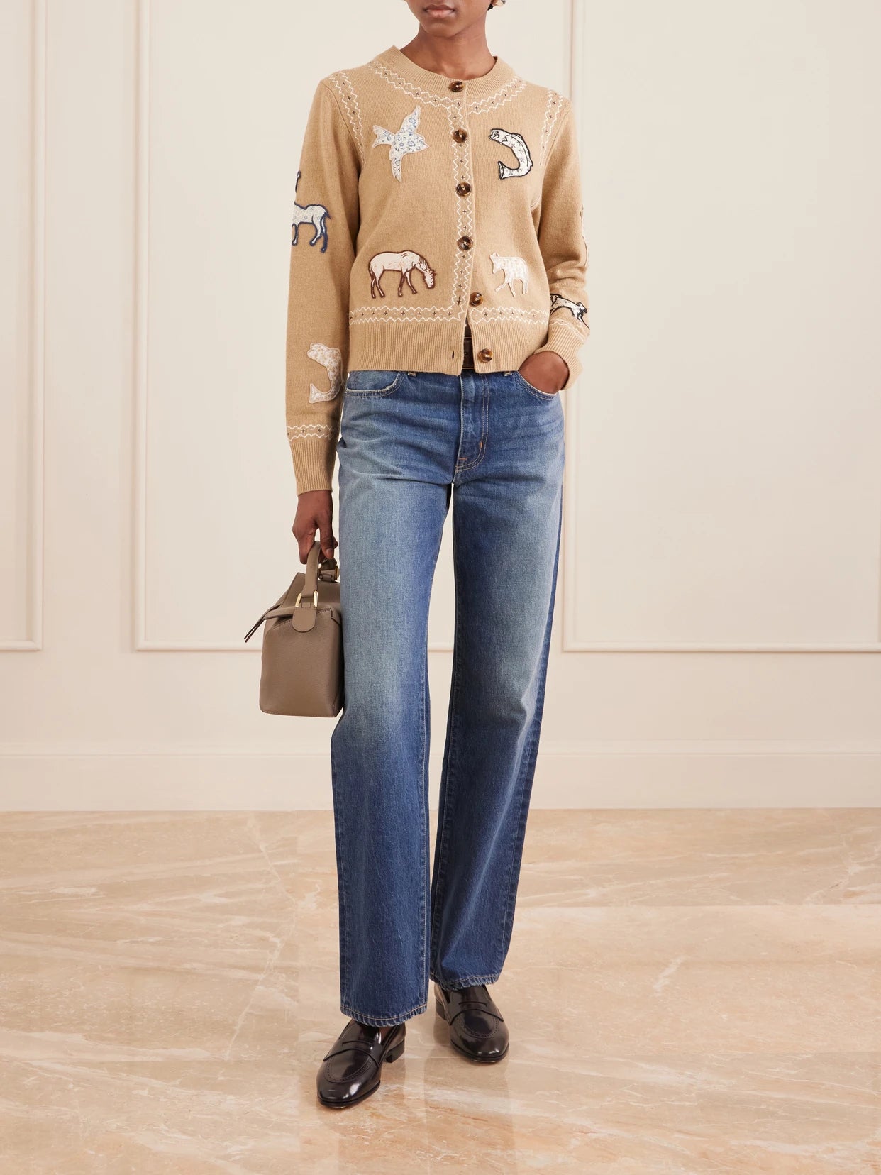 Image of a model wearing Outerwear. Product name - Winslow Appliquéd Wool Cardigan in Beige colour by brand - Sea
