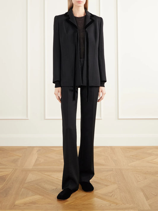 Image of a model wearing Outerwear. Product name - Neva Cashmere Knitted T-shirt in Black colour by brand - The Row