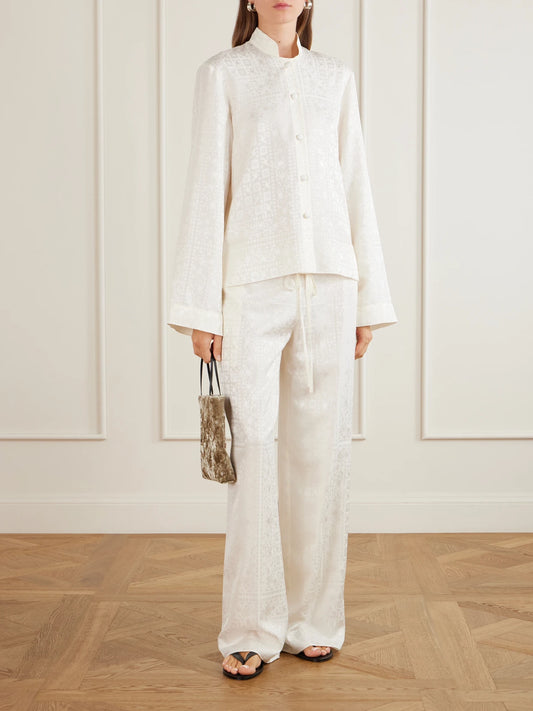 Image of a model wearing Tops. Product name - Nisha Silk-jacquard Shirt in Ivory colour by brand - LIBEROWE