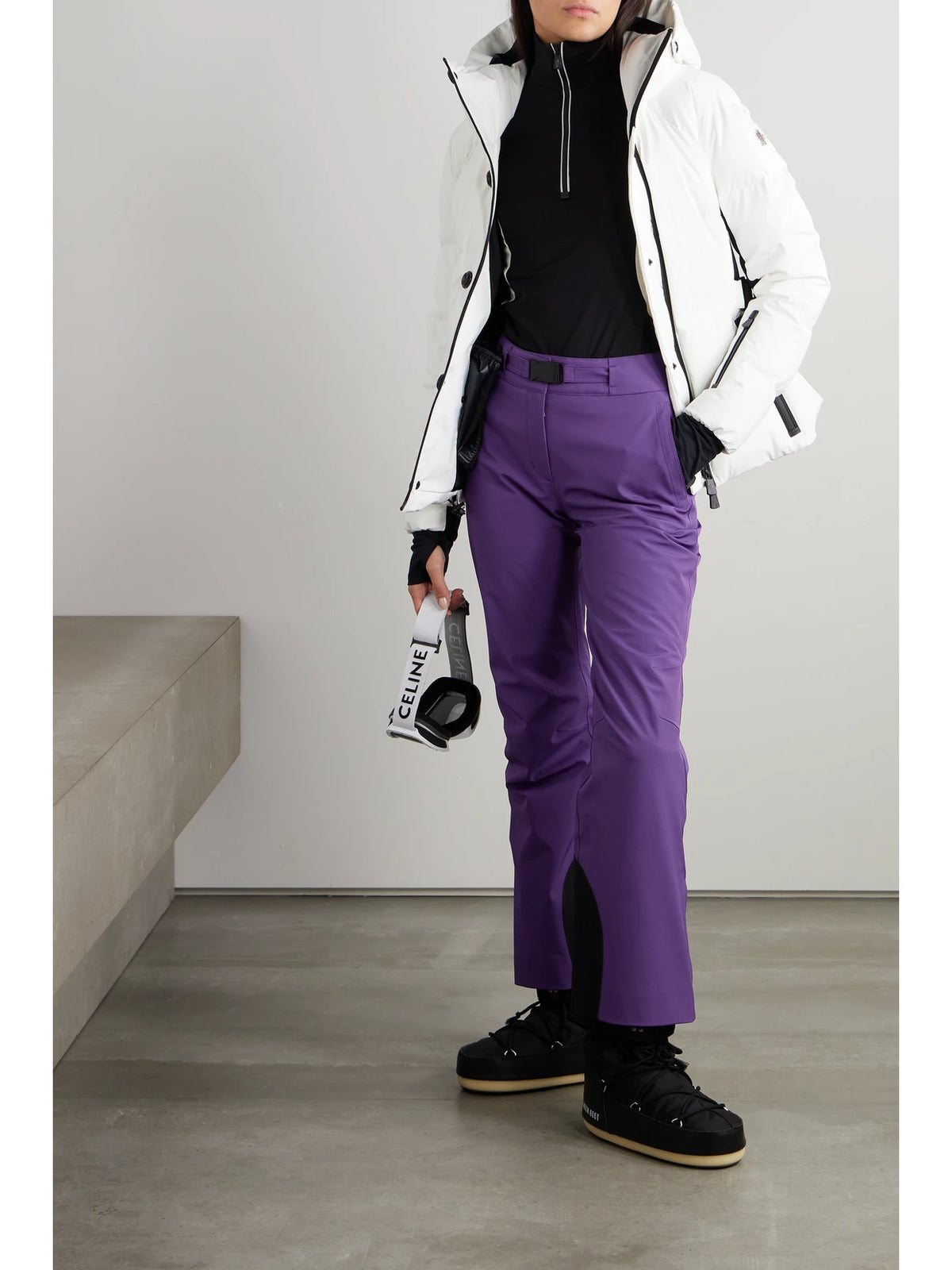 Image of a model wearing Pants. Product name - Buckled Bootcut Ski Pants in Purple colour by brand - Moncler Grenoble