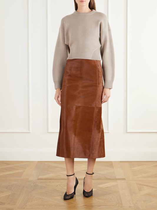 Image of a model wearing Skirts. Product name - Paneled Calf-hair Midi Skirt in Brown colour by brand - Alaïa