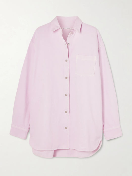 Image of a model wearing Tops. Product name - + Maria Mcmanus Oversized Organic Denim Shirt in Pastel pink colour by brand - AGOLDE