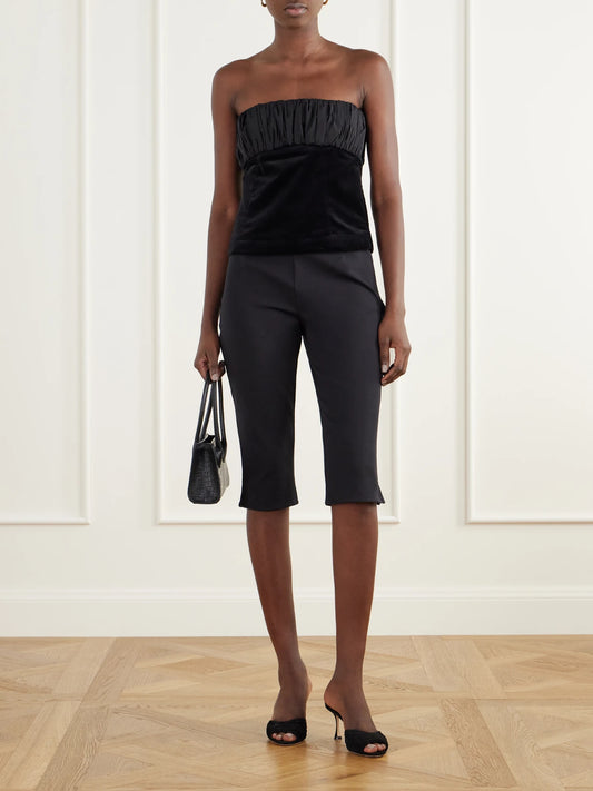 Image of a model wearing Pants. Product name - Mina Stretch Cotton-velvet Slim-leg Capri Pants in Black colour by brand - Posse