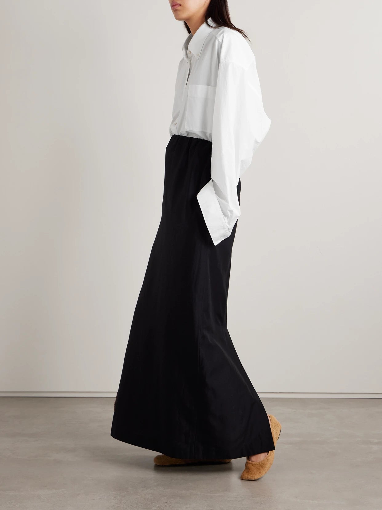 Image of a model wearing Tops. Product name - Victoria Oversized Cotton-poplin Shirt in White colour by brand - The Row